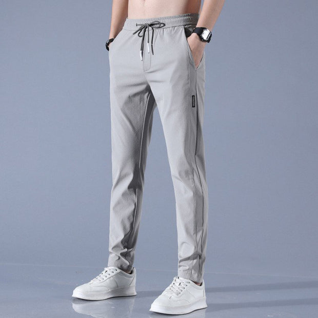Pantalones casuales de seda de hielo para hombre, versión coreana, tendencia de moda grande, pantalones de pierna recta elásticos y transpirables