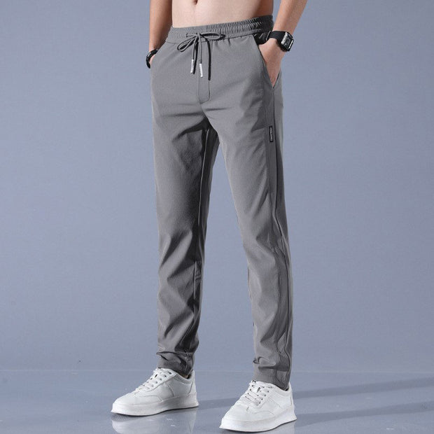 Pantalones casuales de seda de hielo para hombre, versión coreana, tendencia de moda grande, pantalones de pierna recta elásticos y transpirables